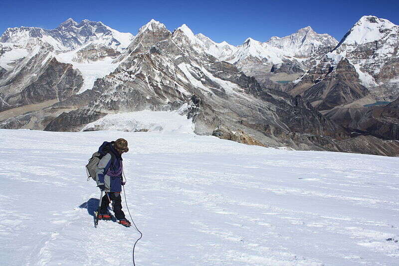 Climber Near The Summit Of Mera With Everest And Makalu In The Distance