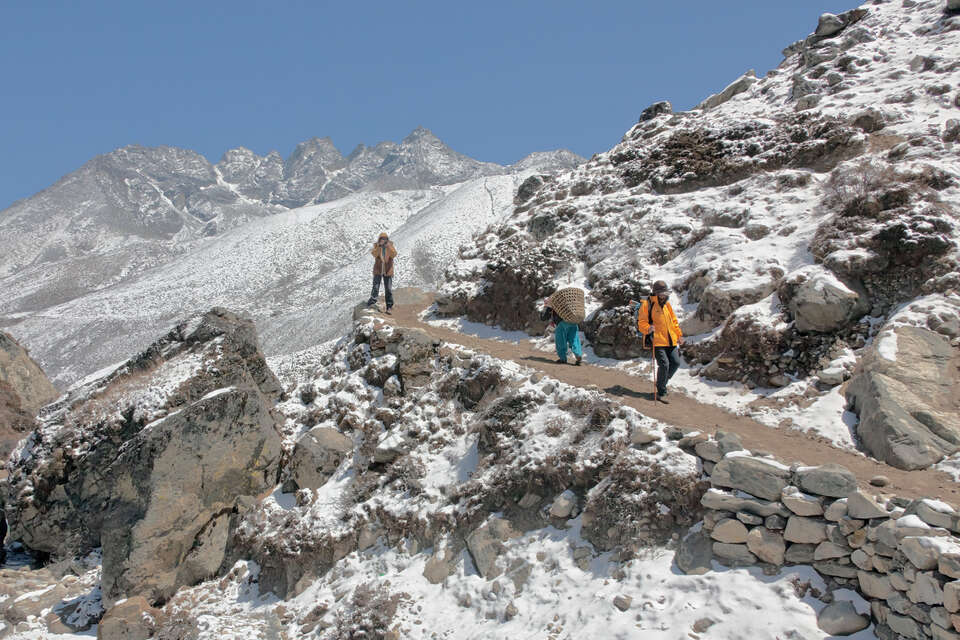 Trekkers climbing the trail near Lobuche on the Everest Base Camp route